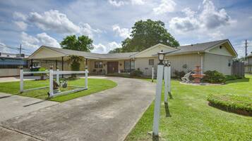 Stroll up the curved driveway to the inviting front porch, where a beautiful garden and decorative fountain await.