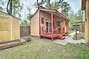 Guest house with a charming porch and yard.