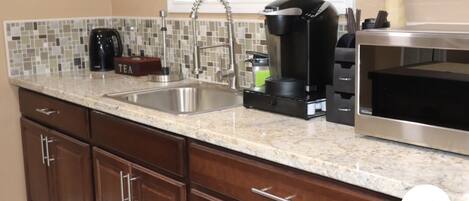 Fridge, microwave, coffee/tea maker, toaster