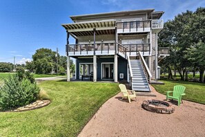 Relax on the upper-floor balcony or enjoy the fire pit in the well-maintained lawn.