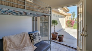 A balcony with a sofa, a bunk bed, and potted plants. - Indio Casita: 2 Mi to Coachella & Stage Coach! (Indio)