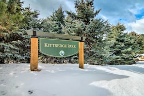A sign for Kittredge Park surrounded by snow-covered trees. - Near Red Rocks, Hiking & Skiing: Kittredge Condo! (Kittredge)