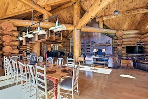 A spacious log cabin interior with a large dining area, kitchen, and living room. - 22str-00019 Fairplay High Country Lodge w/ Hot Tub (Fairplay)
