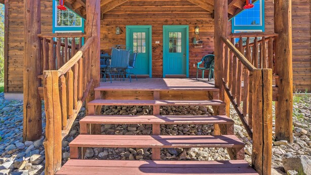 A wooden cabin with a porch, a staircase, and two doors. - 6 Mi to Turquoise Lake: Retreat w/ Covered Deck! (Leadville)