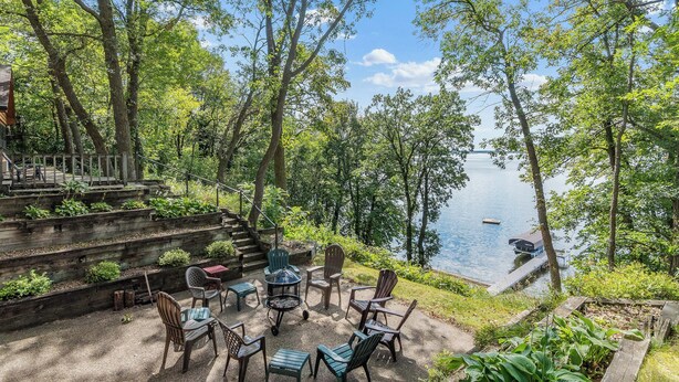 A lakeside patio with outdoor seating and a dock. - Sandy Beach Family Getaway w/ Fire Pit & Deck! (Alexandria)