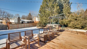 A wooden deck with benches and a basketball hoop. - 9 Mi to Dtwn: Quiet South Denver Apartment (Lakewood)