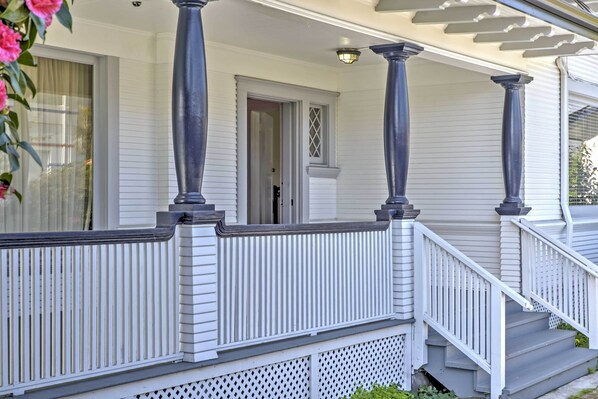 A white house with a porch, columns, and a staircase. - Carpinteria Apt w/ Hot Tub - 10 Min Walk to Beach! (Carpinteria)