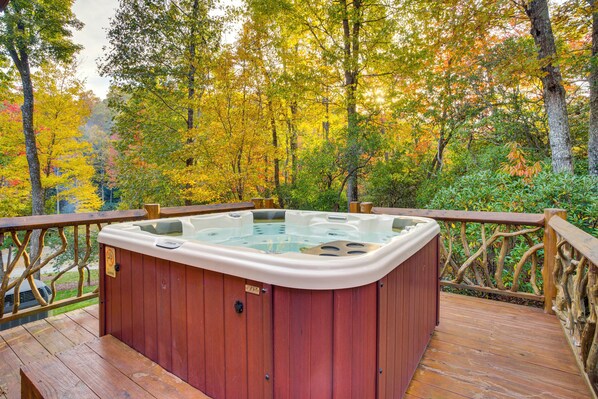 A hot tub on a wooden deck with a view of autumn trees. - 25-acre Mountain Retreat w/ Trails, Pond, Hot Tub (Penrose)