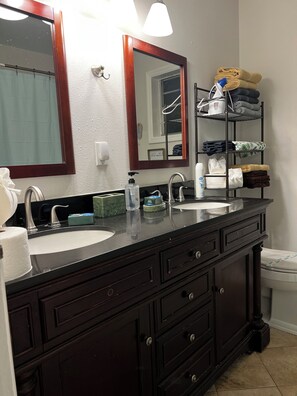 Shower, hair dryer, towels, soap