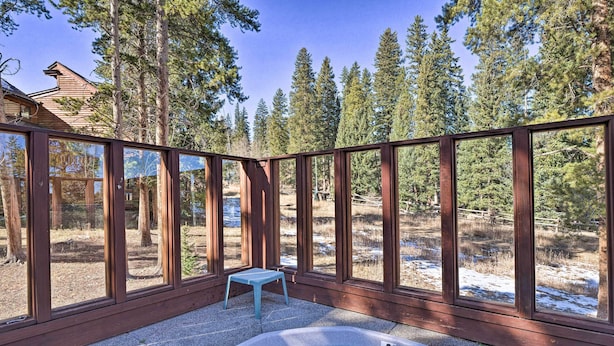 A hot tub area with a view of a forested landscape. - Ski-in/out Access + Hot Tub! Breckenridge Condo (Breckenridge)
