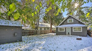 A residential area with a house, a shed, and a fenced yard covered in snow. - Cozy Spokane Getaway Near Golfing & Skiing! (Spokane)
