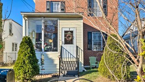A small, single-story house with a front porch, a mailbox, and a wreath on the door. - 5 Mi to National Mall: Home in Washington DC (Washington)