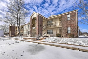 A multi-story apartment building with a brick facade and a balcony on the second floor. - Branson Vacation Rental w/ Resort Amenities (Branson)