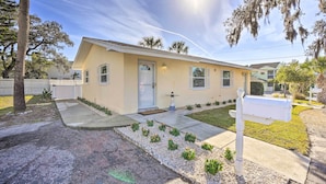 A single-story house with a front porch, a mailbox, and a well-maintained lawn.