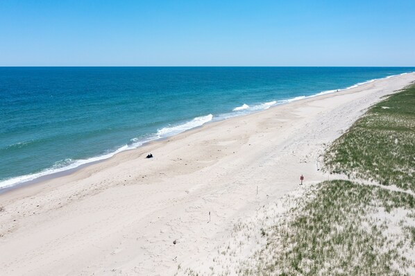 On the beach, sun loungers, beach towels