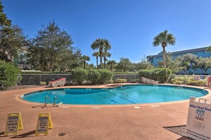 A swimming pool with a notice sign indicating it is closed. - Walk to Ocean: Condo w/ Community Perks on HHI (Hilton Head Island)