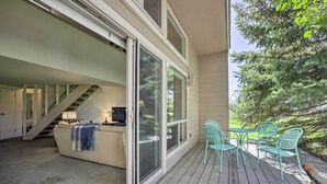 A modern home with a sliding glass door leading to a deck. - Pagosa Springs Condo Near Springs + Trails! (Pagosa Springs)