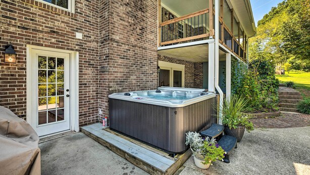 A brick house with a hot tub on the patio. - Clemson Getaway < 3 Mi to Memorial Stadium! (Clemson)