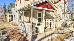 A house with a covered porch, a chimney, and a red roof. - 3 Mi to Dtwn: Convenient Denver Apt (Denver)