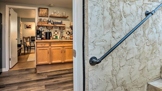 A kitchen with wooden cabinets, a coffee maker, and a tiled backsplash. - 3 Mi to Dtwn: Convenient Denver Apt (Denver)