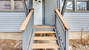 A wooden staircase leading to a front door with a small porch area. - Telluride Condo: Walk to Lift, Bear Creek, & More! (Telluride)