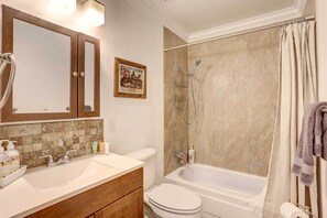 A bathroom with a sink, toilet, and bathtub. - Centennial Home w/ Game Room, 11 Mi to Downtown! (Littleton)