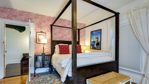 A four-poster bed with a canopy, a small bench, a patterned rug, and a framed picture on the wall. - On-site Pond: Spacious Family Home in Jefferson! (Jefferson)