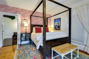A four-poster bed with a canopy, a small bench, a patterned rug, and a framed picture on the wall. - On-site Pond: Spacious Family Home in Jefferson! (Jefferson)