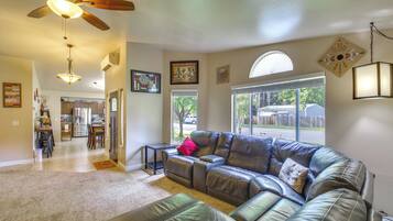 House (3 Bedrooms) | Living area | TV, fireplace, books