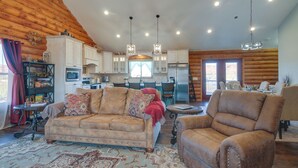 A cozy log cabin interior with a living room, dining area, and kitchen. - 'the Cliffrose Cabin' - Hike, Relax, Explore! (Kanab)