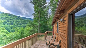 A wooden cabin with a balcony overlooking a forested mountain. - Quaint Log Cabin w/ Views Near West Jefferson (Warrensville)