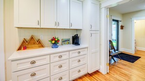 A kitchen with white cabinets, a coffee maker, and a sign that says "COFFEE." - Stunning Damascus Vacation Rental w/ Fire Pit! (Damascus)