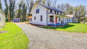 A two-story house with a porch, a gravel driveway, and a small shed in the yard. - Stunning Damascus Vacation Rental w/ Fire Pit! (Damascus)