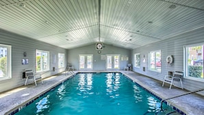 An indoor swimming pool with clear water, marked depth, and lifeguard signs. - 5 Mi to Beach: Myrtle Beach Condo w/ Pool Access (Myrtle Beach)