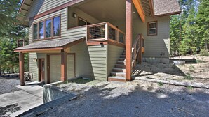 A two-story house with a covered porch, a staircase, and a garage. - 5 Mi to Crescent Lake: Dog-friendly Oregon Getaway (Crescent)