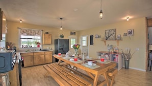 A spacious kitchen with wooden countertops, a central island, and pendant lighting. - Secluded Angler's Haven - Boat + Fish! (Rosston)