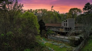 A two-story house with a deck and a staircase leading to a second level. - Hot Tub & Mini Golf: Mtn-view Haven in Kodak! (Kodak)