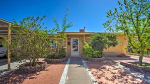 A brick building with a central entrance, surrounded by landscaped areas with trees and shrubs. - El Paso Home < 1 Mi to Lone Star Golf Club! (El Paso)