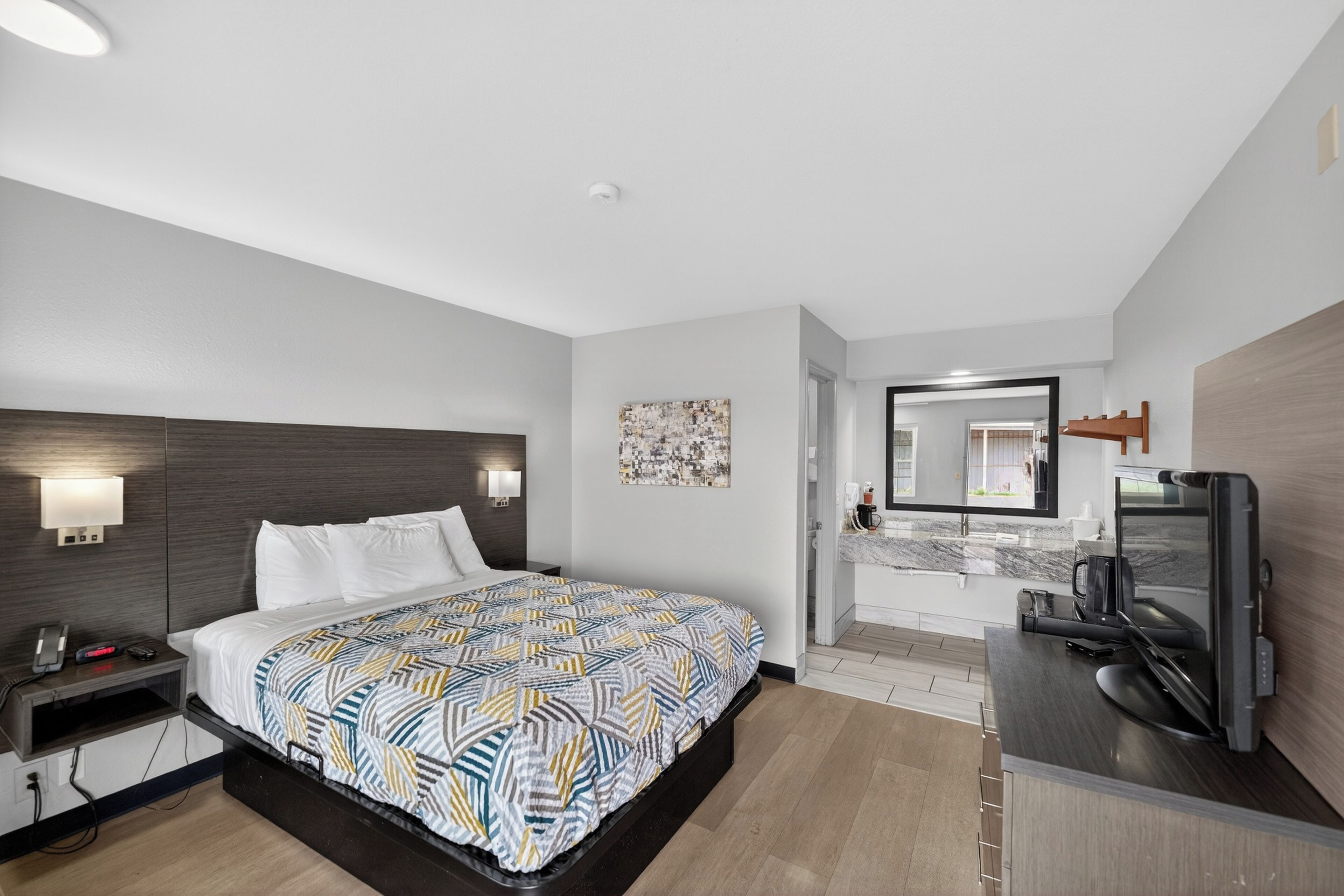 Premium bedding, pillowtop beds, laptop workspace, blackout drapes