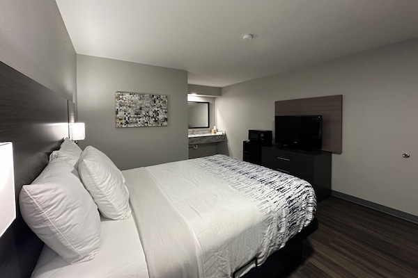 Premium bedding, pillowtop beds, laptop workspace, blackout drapes