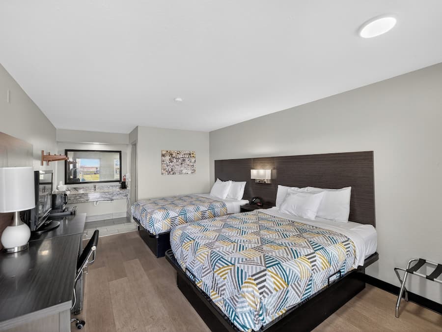 Premium bedding, pillow-top beds, laptop workspace, blackout curtains