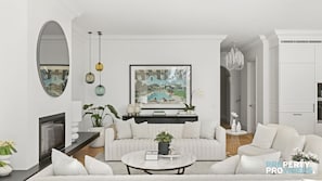 Relax in this stylish living room with a large mirror, flat-screen TV, and comfortable sofa set.