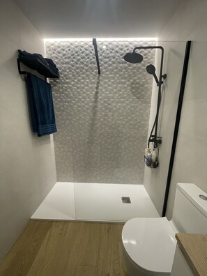 Shower, hair dryer, towels, soap
