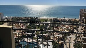 A resort with a pool, beach, and ocean view.