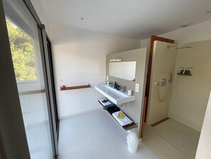 Shower, hair dryer, towels, soap