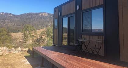 Modern cabin offering incredible views with fire pit, spa and hiking trails.