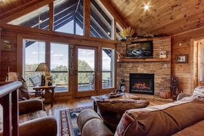 Chalet rustique, 1 très grand lit, baignoire à remous, vue sur la montagne | Aire de séjour