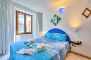 Familienapartment, Mehrere Schlafzimmer, Bergseite (Il Nido dell'Artista) | 1 Schlafzimmer, kostenloses WLAN, Bettwäsche