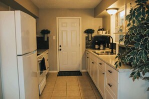 Fridge, microwave, stovetop, coffee/tea maker