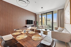 Elite Apartment | Living area | 50-inch Smart TV with digital channels